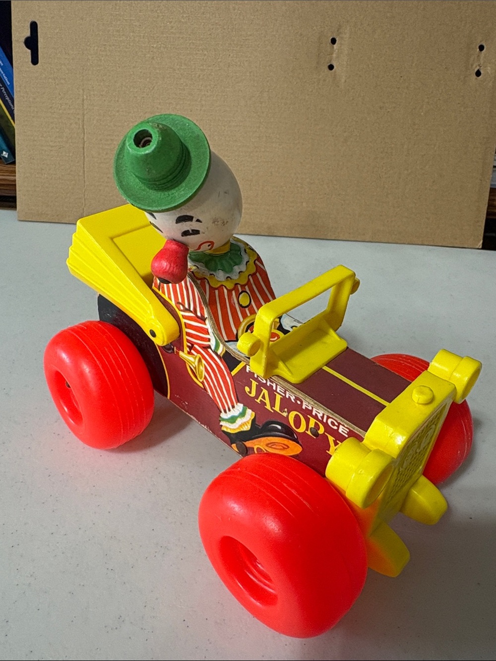 Fisher-Price Vintage Clown Pull Car in Red, Yellow & Green